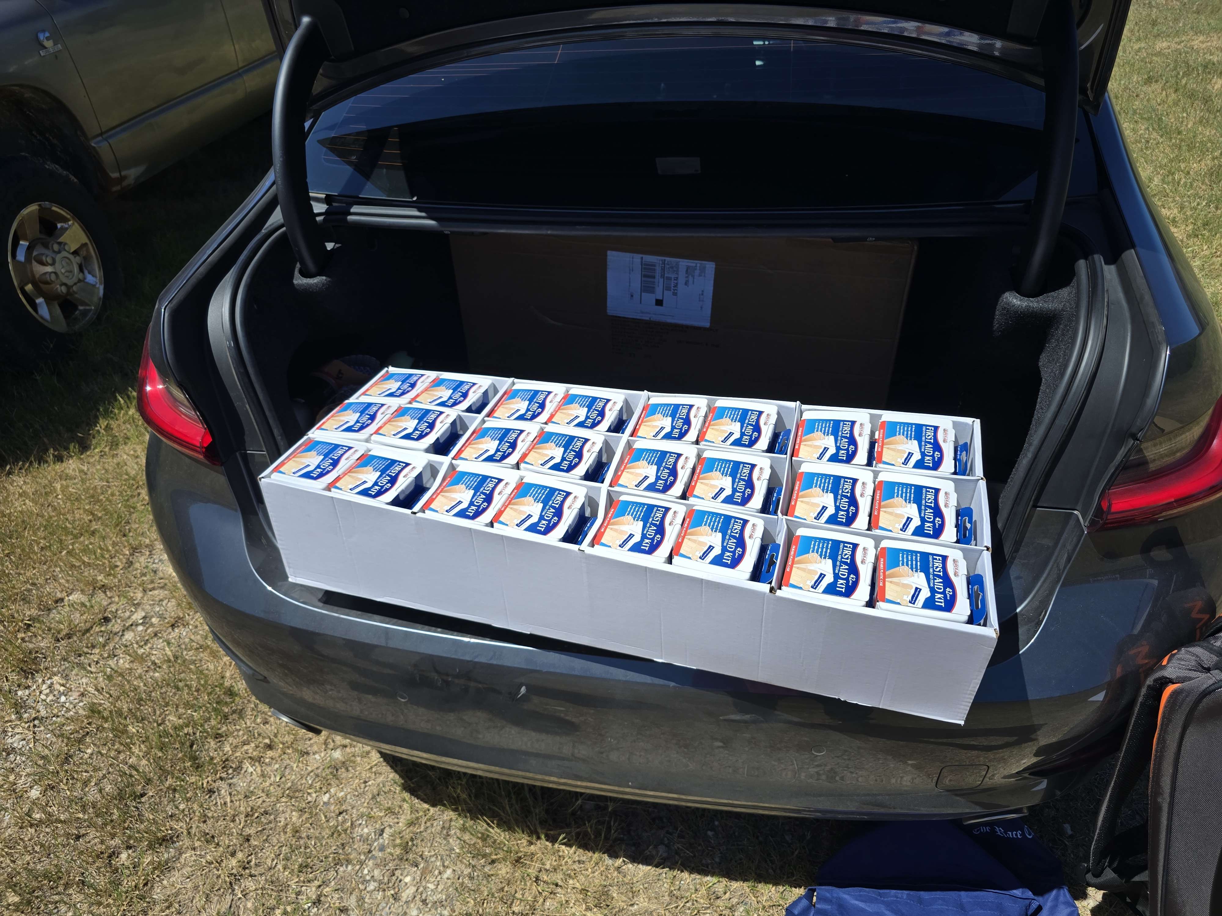 Trunk loaded with boxes of first-aid kits for Abba's House