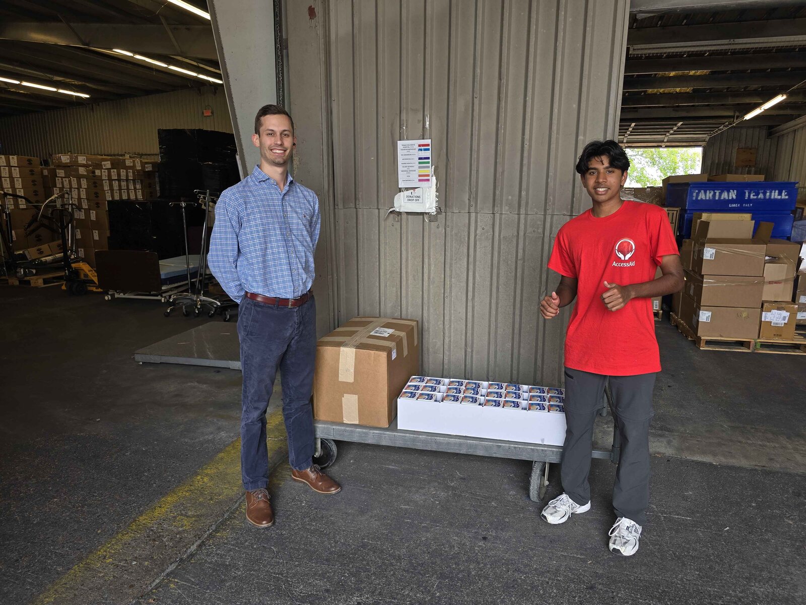 AccessAid volunteer with Medical Bridges staff member