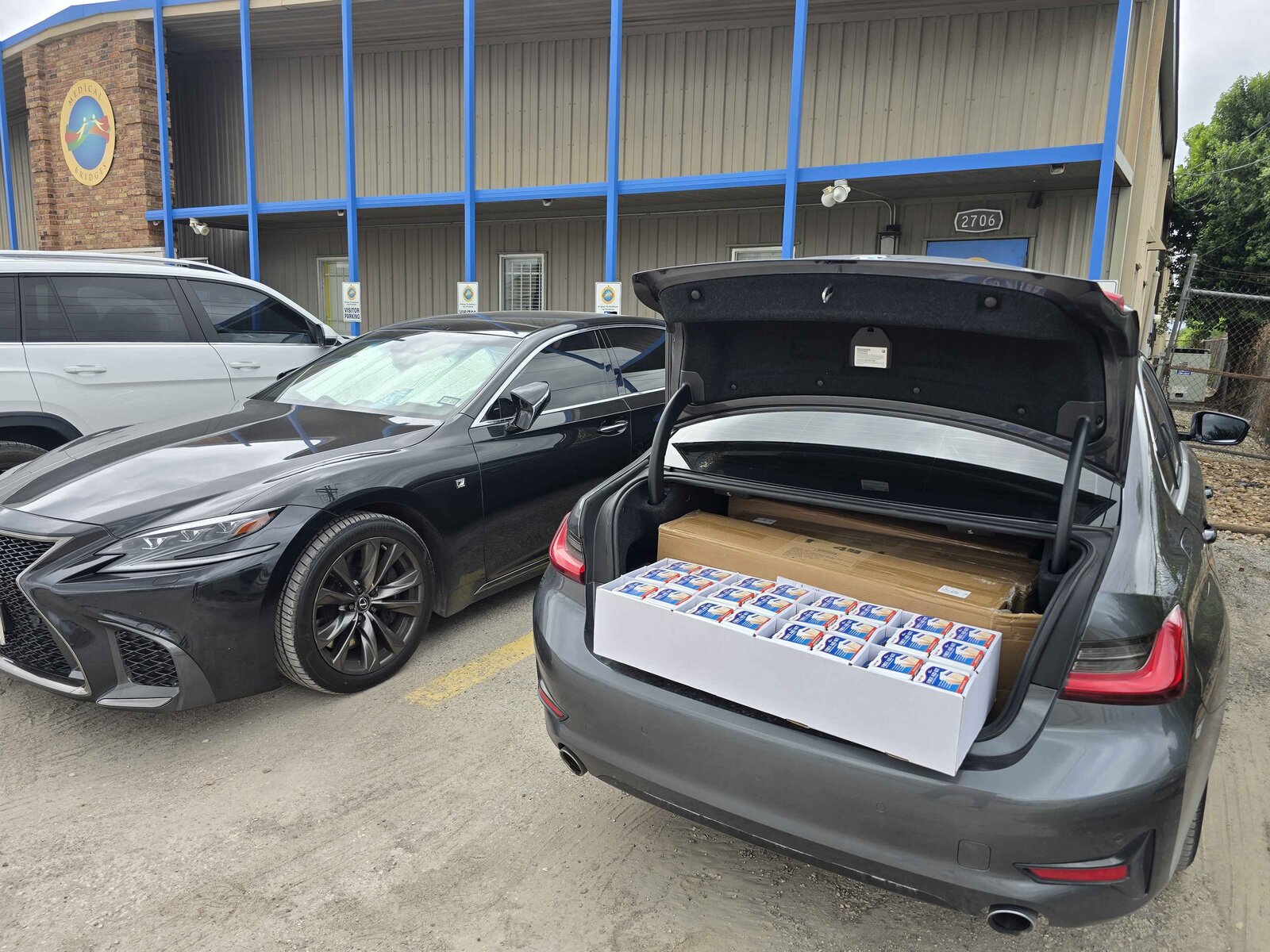 Trunk loaded with boxes of masks and supplies at Medical Bridges