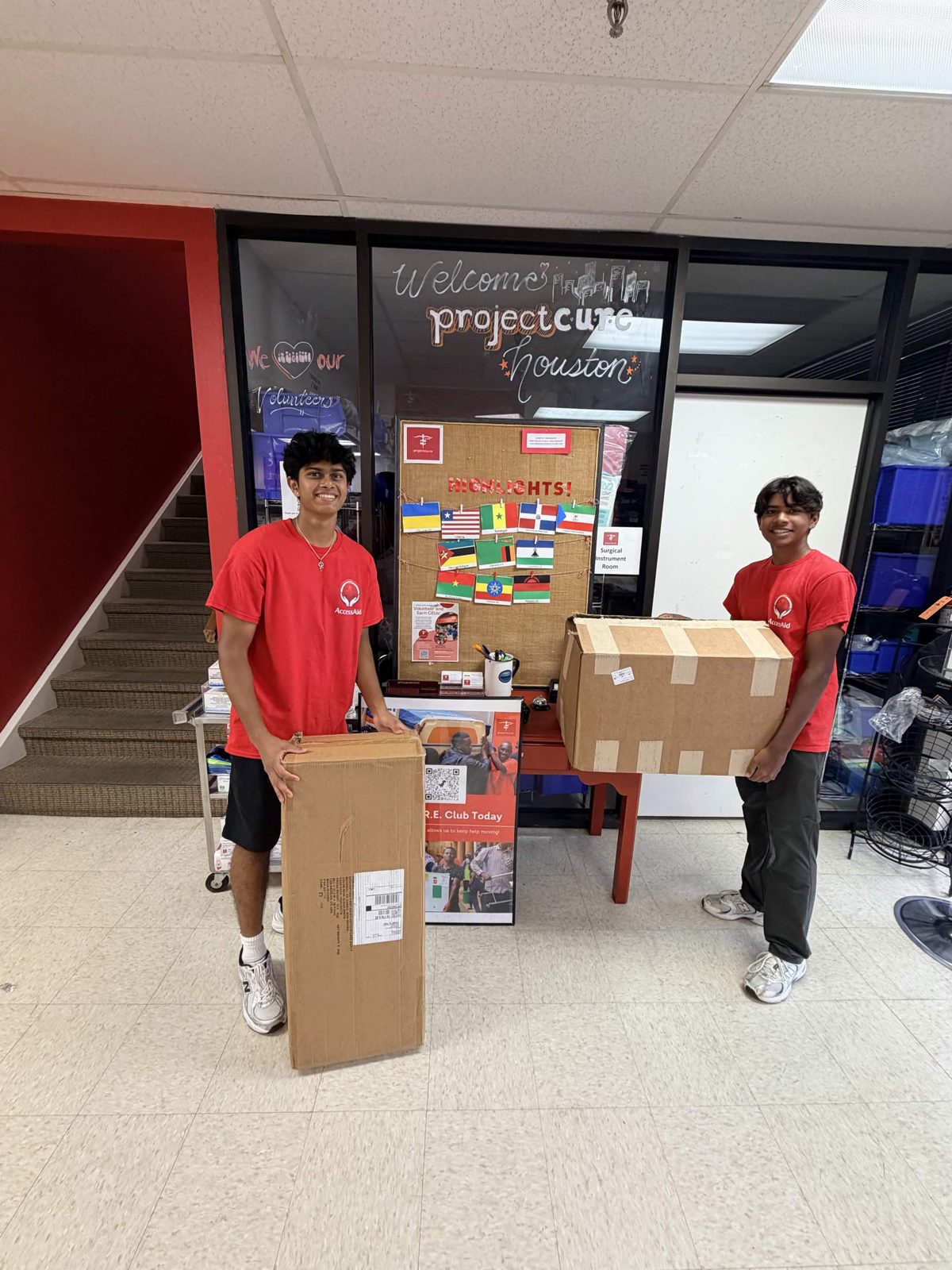 AccessAid volunteers delivering boxes to Project C.U.R.E. Houston